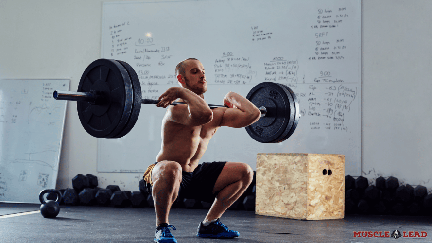 Man performing squat with wrestling shoes