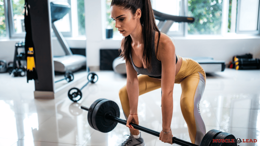 A female lifter performing Sumo deadlift stance